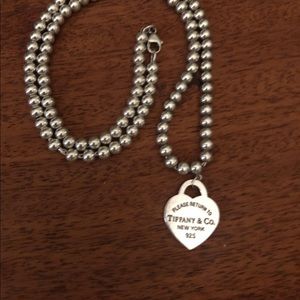 Return to Tiffany beaded necklace with heat charm.